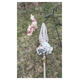 lot of outdoor decorations, including an umbrella, howling, dog statues, and wind catchers