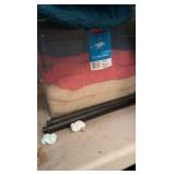 One container of various zip up hoodies and container of towels
