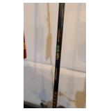 two fishing poles one still has a tag