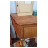 vintage sewing machine with singer thread holder and sewing machine attachments