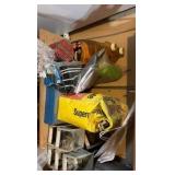shelf contents including fertilizer, cleaner, nail screws, and tools