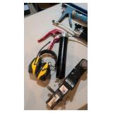 Grease gun ear protection, caulk gun and trailer hitch