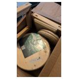 two boxes of of wooden rounds and other wooden items