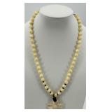 Bead Necklace with Carved Flower Pendant