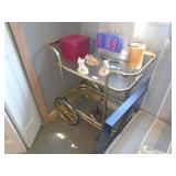 Brass & glass cart with misc figurienes. As shown.CASH ON SITE ONLY. PICKUP IS TUESDAY MAY 19TH FROM 11 AM TO 4 PM. REGARDLESS WHAT THE SCHEDULE STATES.