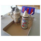 2 german steins. As shown. CASH ON SITE ONLY. PICKUP IS TUESDAY MAY 19TH FROM 11 AM TO 4 PM. REGARDLESS WHAT THE SCHEDULE STATES.