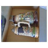 2 german steins. As shown. CASH ON SITE ONLY. PICKUP IS TUESDAY MAY 19TH FROM 11 AM TO 4 PM. REGARDLESS WHAT THE SCHEDULE STATES.