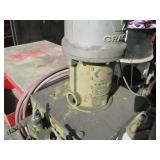 Graco paint sprayer mounted to a wo...