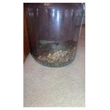Glass gallon jug with pennies.