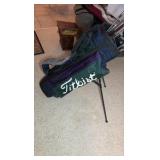 Golf clubs with Titleist golf bag