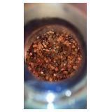 Glass gallon jug with pennies.