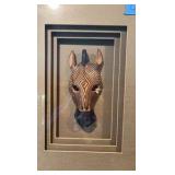 Giraffe and Zebra Masks in framed shadow boxes