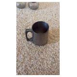 Coasters, London plates, pewter cups.
