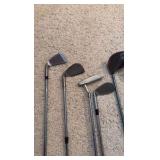 Golf clubs with Titleist golf bag
