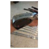 Golf clubs with Titleist golf bag