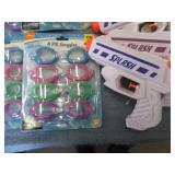 Lot of swim goggles and squirt guns...
