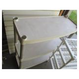 Pair of plastic shelving units in a...