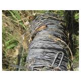 Spool of fence wire and 4ft sign po...
