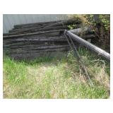 Large pile of weathered wood planks...