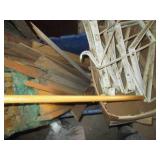 Plastic tote containing long wood d...
