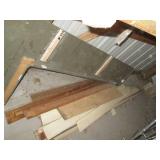 Bundles of assorted wood planks and...