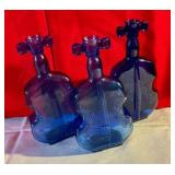 Collectable group of cello shaped cobalt blue glass bottles
