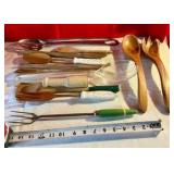 Vintage wooden salad forks and spoons and various utensils monkey pod