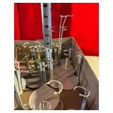 Large group of metal doll stands