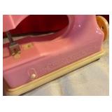 Vintage plastic toy sewing machine