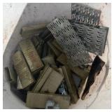 assorted bucket of staples and screws
