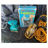Lot of lantern, light, and sander