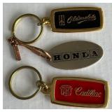 (3) Vintage Automotive Promotional Keychains - Cadillac, Oldsmobile, Honda