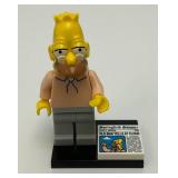RARE Collectible Hard To Get GRAMPA SIMPSON Genuine Lego Mini figure With Newspaper And Stand