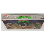 Est. $175.00-$300.00 NECA Teenage Mutant Ninja Turtles: Turtles In Disguise Action Figure Playset (New)