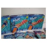 Pool loungers and inflatable arm ba...