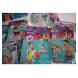 Pool loungers and inflatable arm ba...