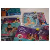 Pool loungers and inflatable arm ba...