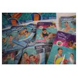 Pool loungers and inflatable arm ba...