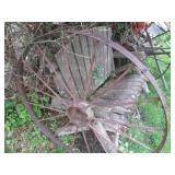 Rustic barnwood and metal wagon whe...