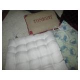 Stack of padded seat cushions...