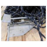 Waterspike boat anchor with rope.