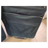 Set of Black Luggage with Wheels and Handles