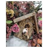 Decorative Birdhouse and Floral Arrangements