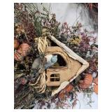 Decorative Birdhouse and Floral Arrangements