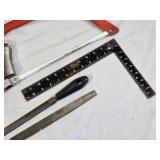 Assorted Tools and Accessories including Husky Hacksaw, Files, Speed Square, Extension Cords, and Power Strip