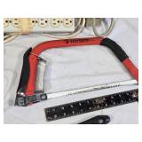 Assorted Tools and Accessories including Husky Hacksaw, Files, Speed Square, Extension Cords, and Power Strip
