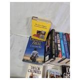 Collection of Books Including Mary Higgins Clark and John Grisham