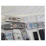 Lot of Remote Controls including Spectrum, DirecTV, Panasonic, and Xfinity