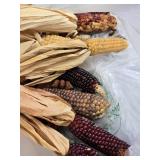 Box of Holiday Decorations with Crystal Party Plate, Corn Decorations, and Santa Figurine
