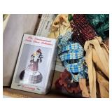 Box of Holiday Decorations with Crystal Party Plate, Corn Decorations, and Santa Figurine